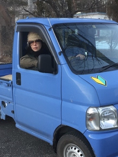 DJ Atechra in a  blue truck