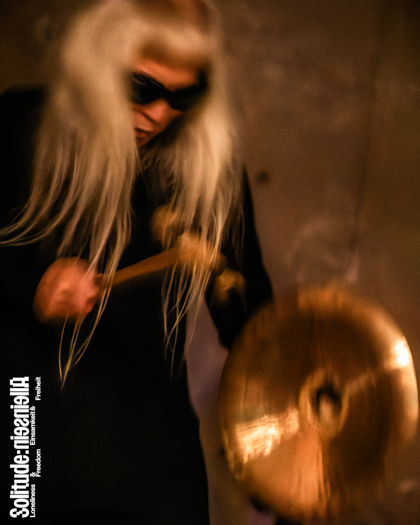 Keiji Haino playing a drum